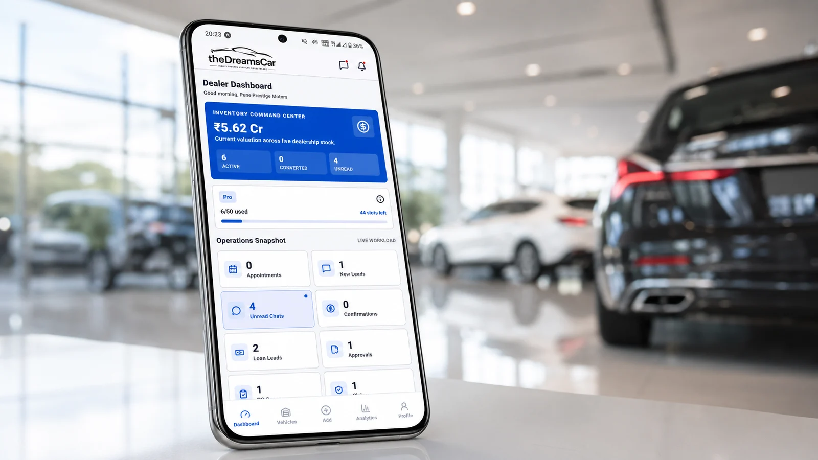 theDreamsCar dealer dashboard displayed on a smartphone in a showroom